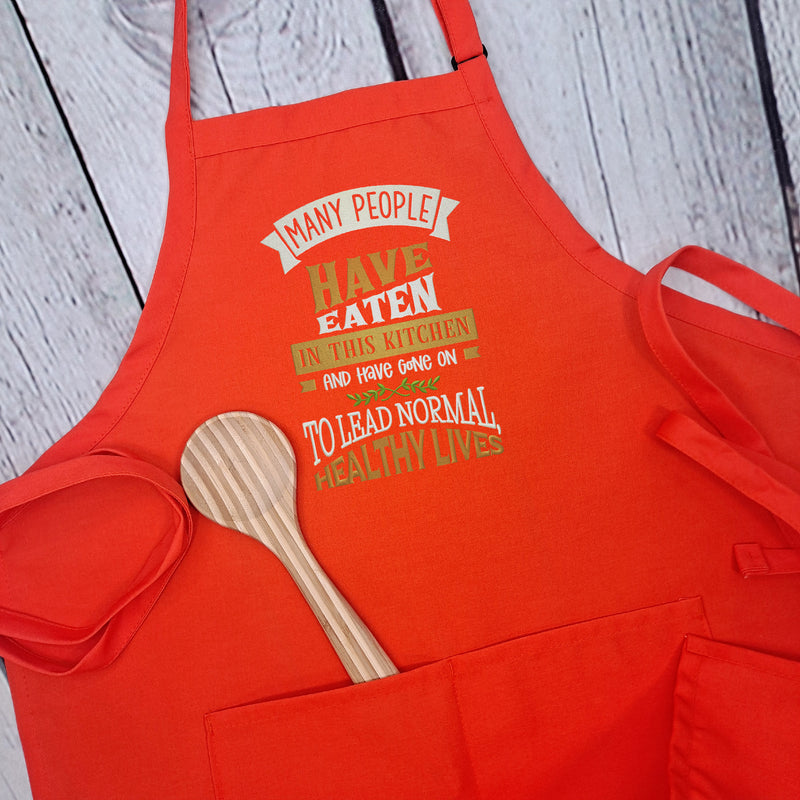 Funny apron Life is what you bake it embroidered kitchen accessory with pockets and adjustable neck multiple lengths great hostess gift